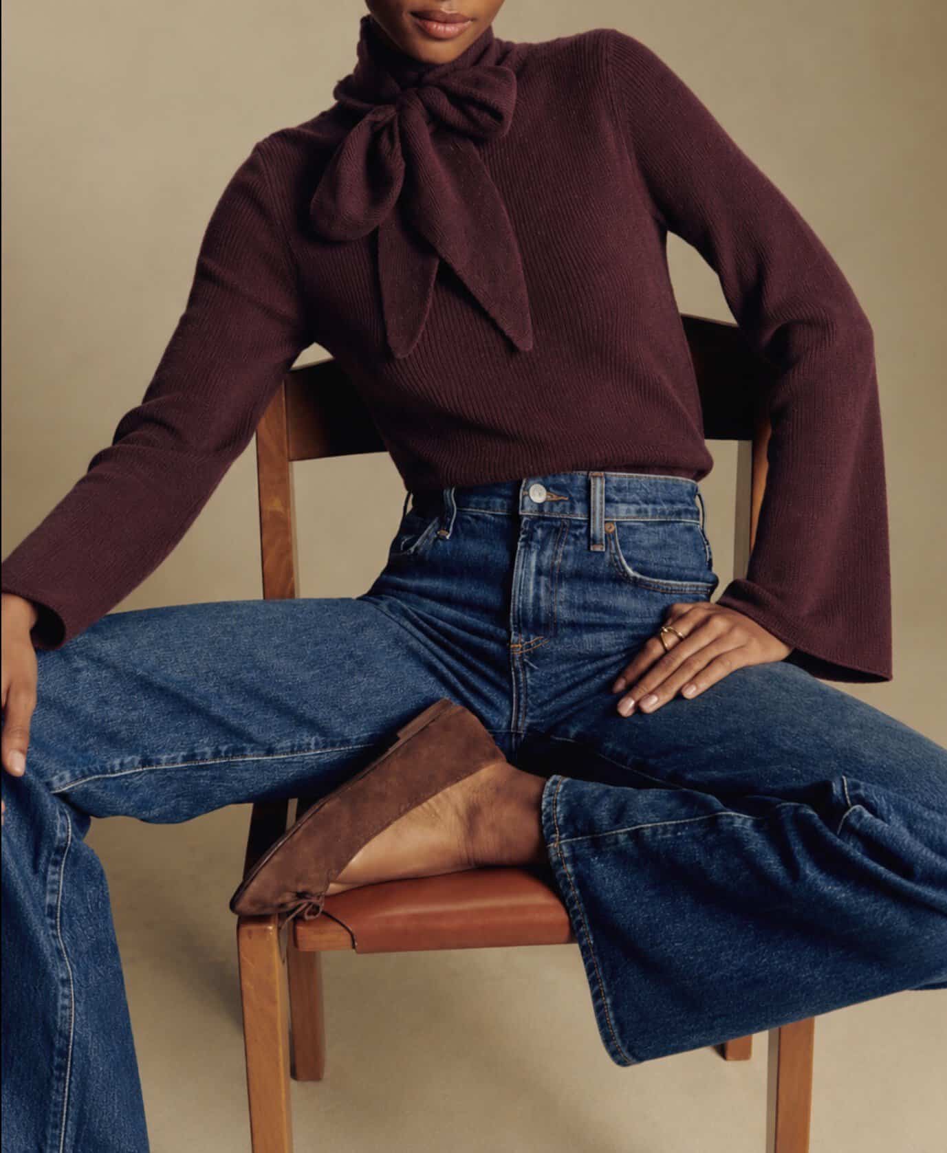 Plum fitted knit 4 Elegant plum fitted knit with bow detail, styled with high-waisted jeans and ankle boots.